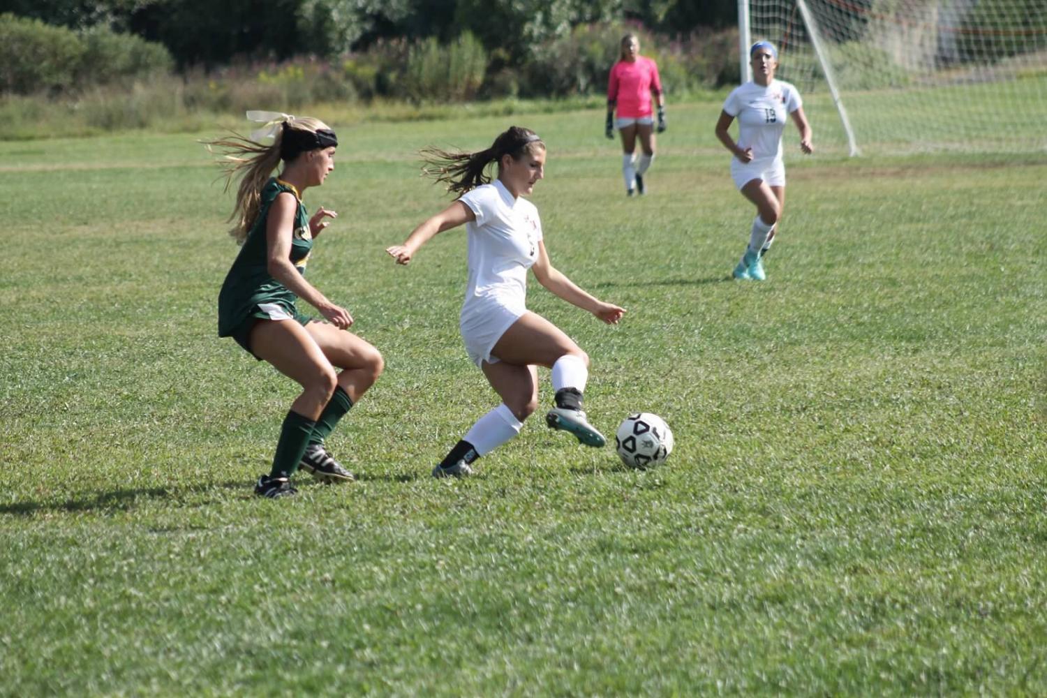 Gabi Triolo (right) keeping ball from RBC