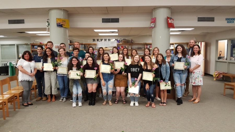 NEHS advisors welcome their newest inductees to the program.  Photo courtesy of Twitter.